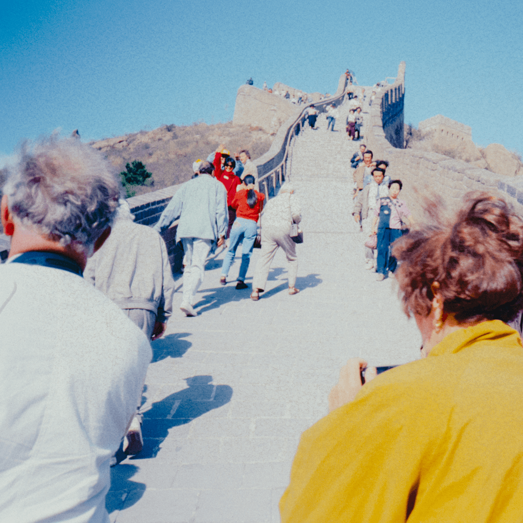 The scene is set outdoors on a bright, clear day, with the sun high in the sky casting sharp, defined shadows.