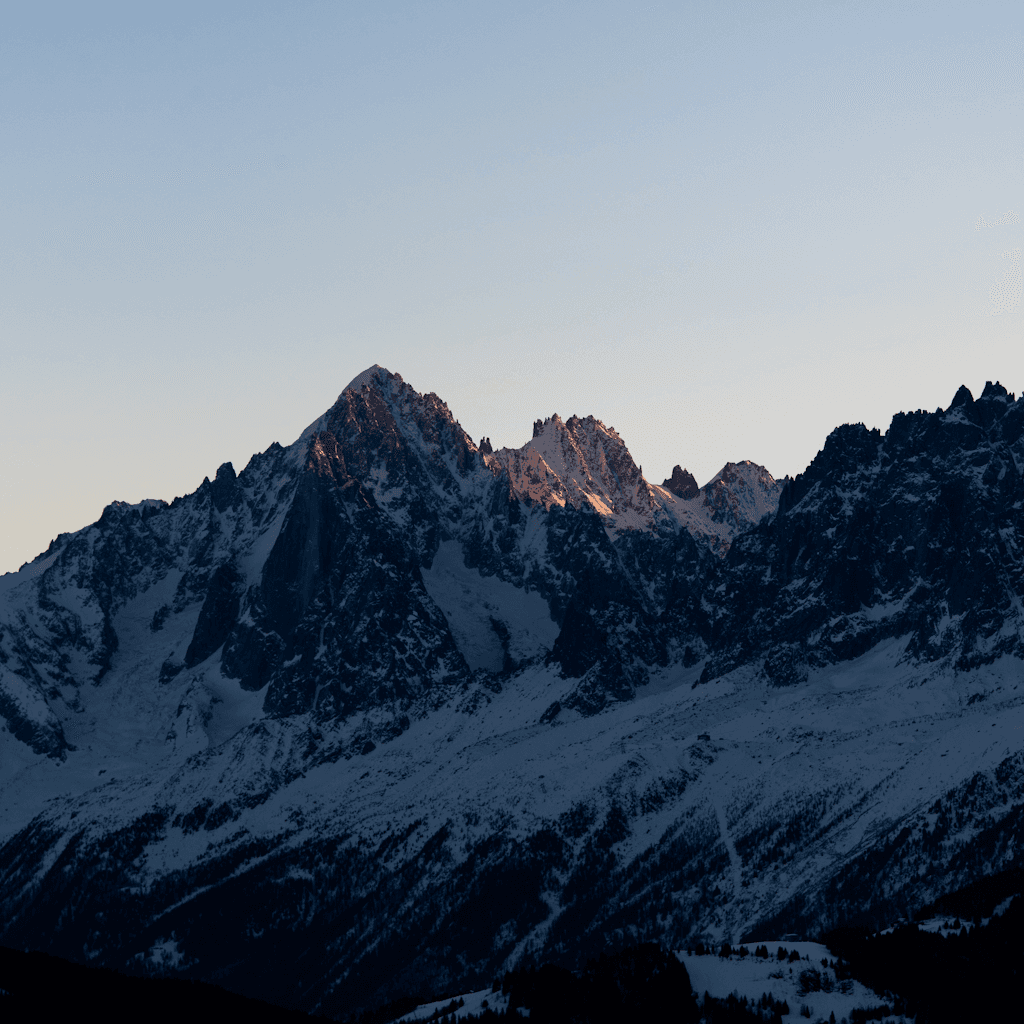 The scene is set outdoors during the gentle transition from dusk to night.