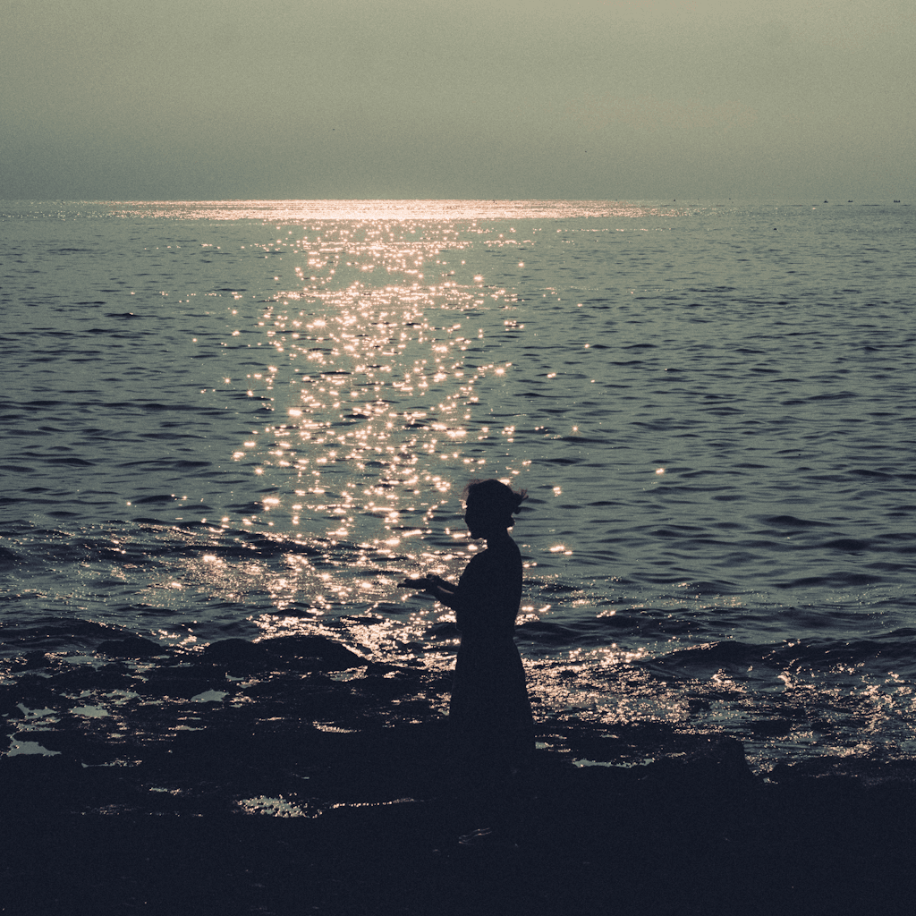 The scene unfolds outdoors, capturing a serene coastal setting.