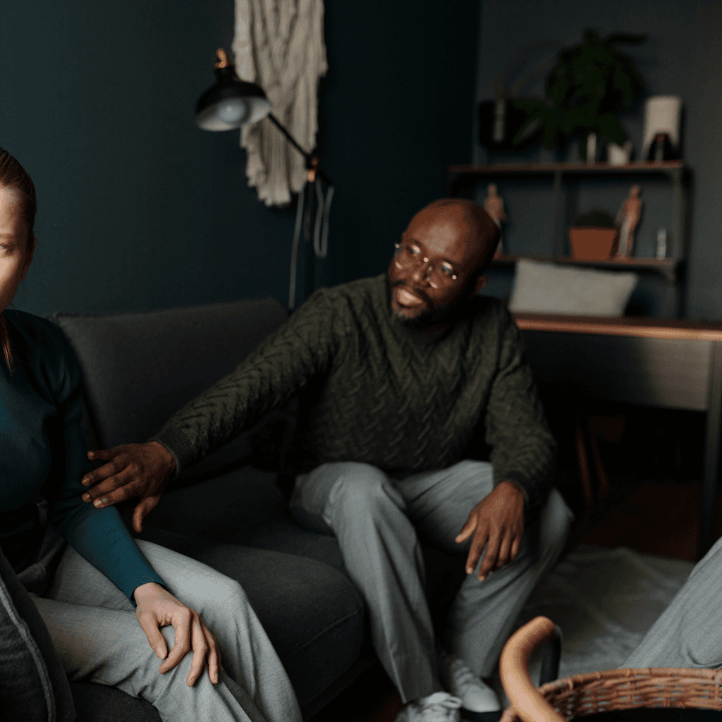 The scene is set indoors in a cozy, dimly lit living room.