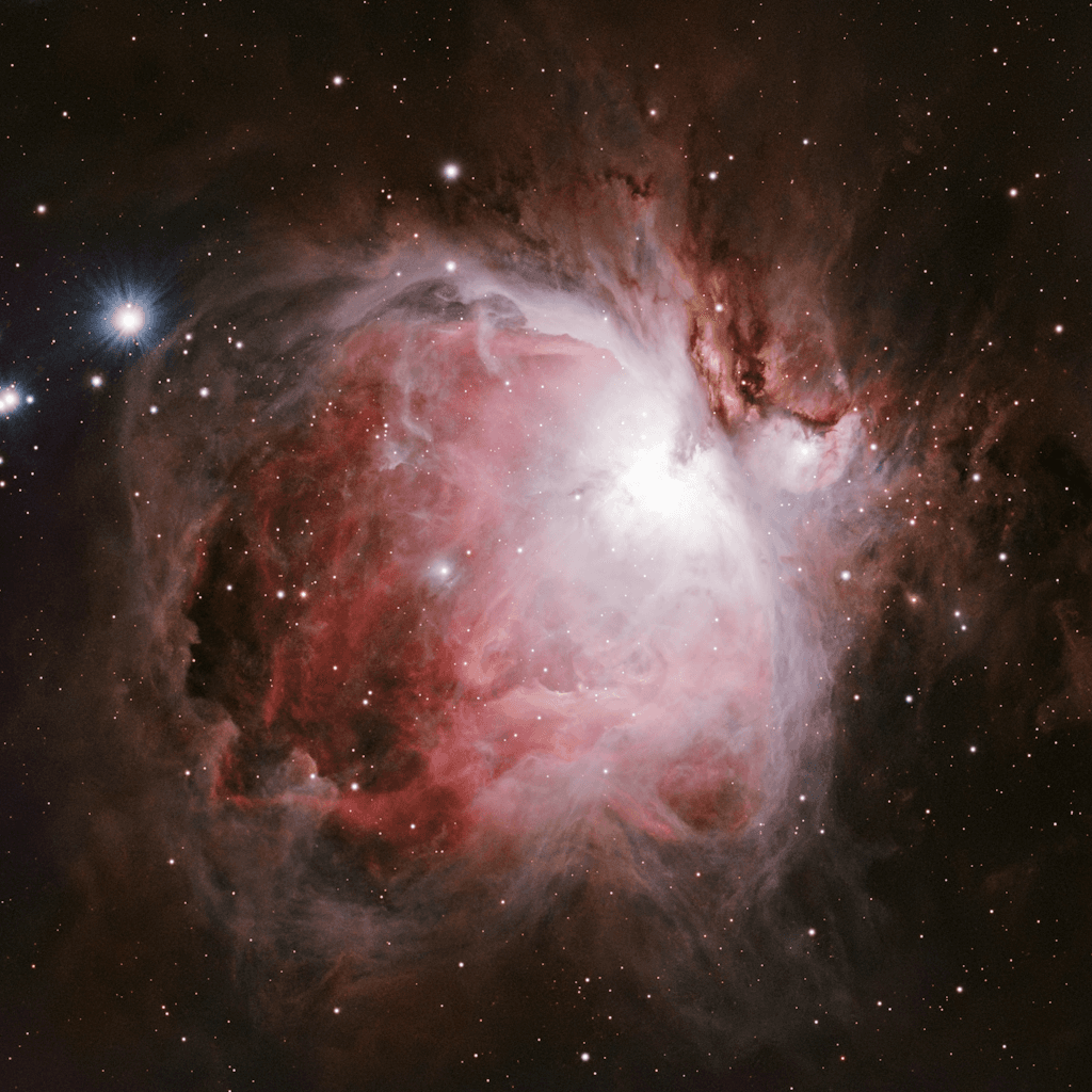 The scene is set in the vast expanse of outer space, characterized by a deep black backdrop dotted with countless twinkling stars.